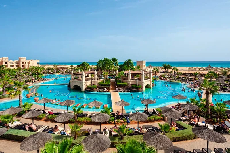 Low-rise buildings and pools of Hotel Riu Touareg on Lacacão Beach, a zoned family and adults-only all inclusive resort on Boa Vista